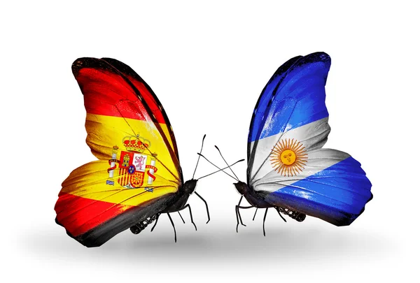 Borboletas com bandeiras de Espanha e Argentina em asas — Fotografia de Stock