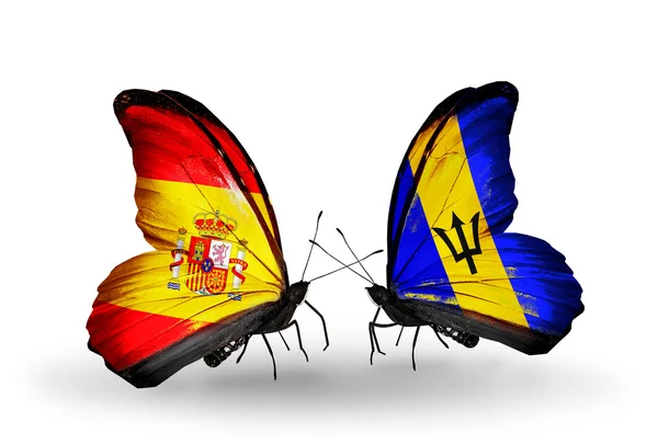 Butterflies with Spain and Barbados flags on wings — Stock Photo, Image