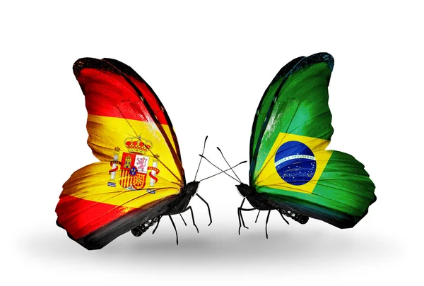 Borboletas com bandeiras da Espanha e do Brasil em asas — Fotografia de Stock