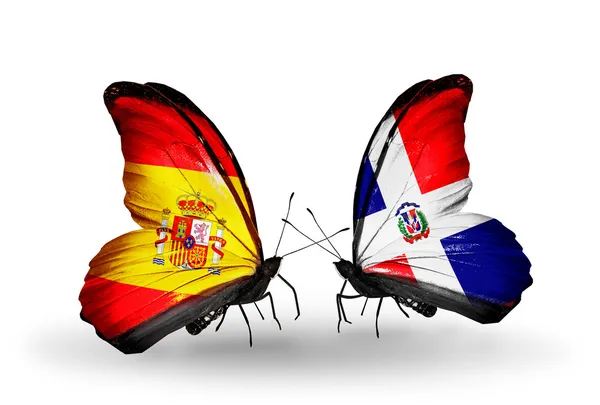 Butterflies with Spain and Dominicana flags on wings — Stock Photo, Image