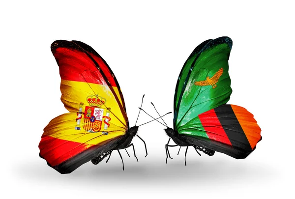 Kelebek kanatları üzerinde İspanya ve Zambiya bayrağı ile — Stok fotoğraf