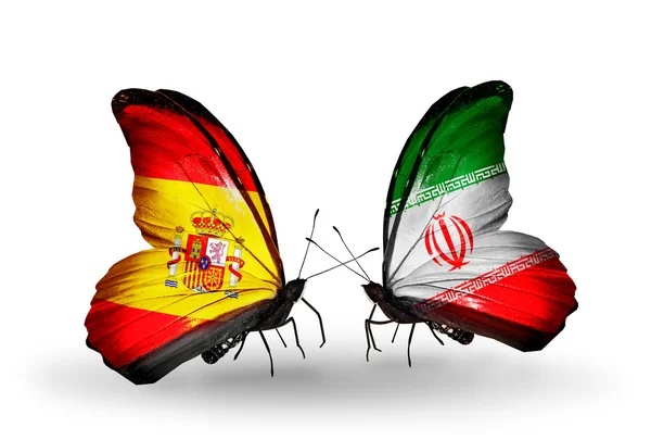 Butterflies with Spain and Iran flags on wings — Zdjęcie stockowe