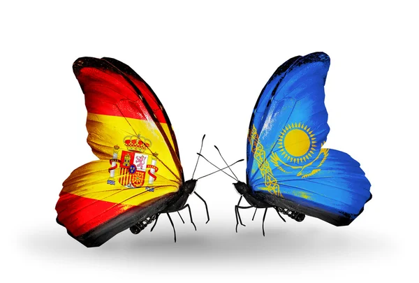 翼の上のスペインとカザフスタンのフラグと蝶 — ストック写真