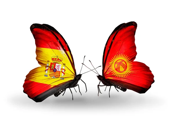 Butterflies with Spain and Kirghiz flags on wings — Stock Photo, Image