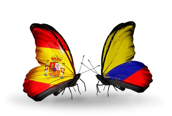 Butterflies with Spain and Columbia flags on wings — Stock Photo, Image