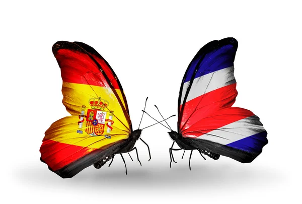 Kelebek kanatları üzerinde İspanya ve Kosta Rika bayraklı — Stok fotoğraf
