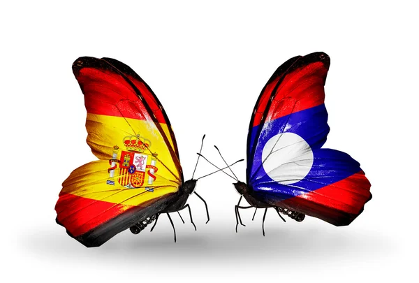 Butterflies with Spain and Laos flags on wings — Stock Photo, Image