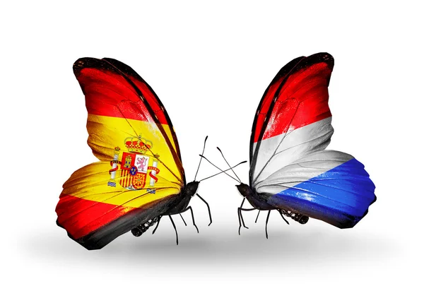 Mariposas con banderas de España y Luxemburgo en alas — Foto de Stock