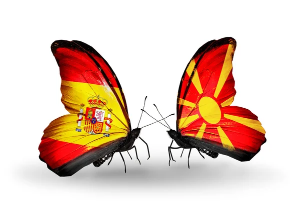 Borboletas com bandeiras de Espanha e Macedônia em asas — Fotografia de Stock