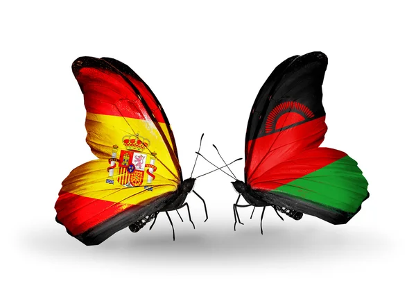 Mariposas con banderas de España y Malawi en alas — Foto de Stock