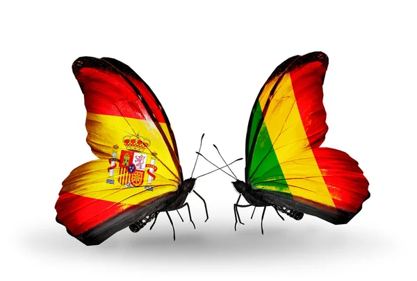 Borboletas com bandeiras da Espanha e Mali em asas — Fotografia de Stock