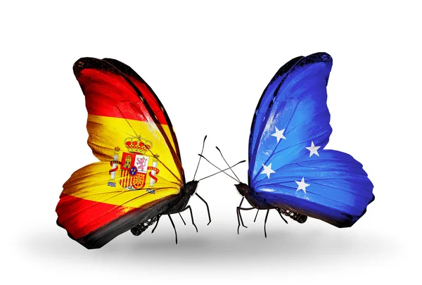 Schmetterlinge mit spanischen und mikronesischen Flaggen auf Flügeln — Stockfoto