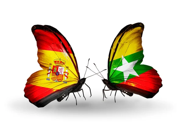 Papillons avec des drapeaux d'Espagne et du Myanmar sur les ailes — Photo