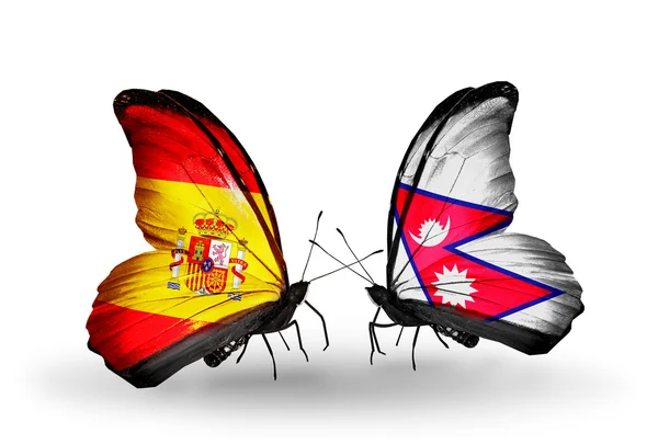 Mariposas con banderas de España y Nepal en alas — Foto de Stock