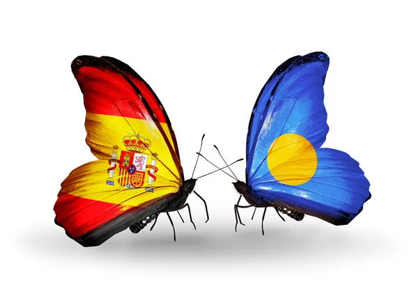 Mariposas con banderas de España y Palaos en alas — Foto de Stock