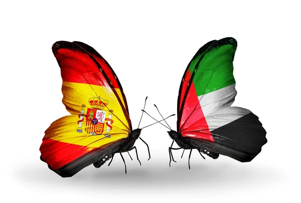 Butterflies with Spain and UAE flags on wings — Stock Photo, Image