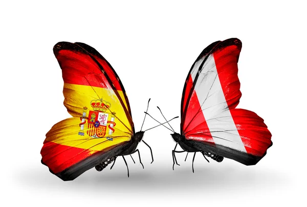 Papillons avec des drapeaux d'Espagne et du Pérou sur les ailes — Photo