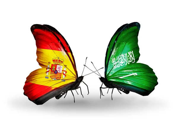 Kelebek kanatları üzerinde İspanya ve Suudi Arabistan bayrağı ile — Stok fotoğraf