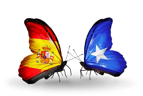 Mariposas con banderas de España y Somalia en alas — Foto de Stock