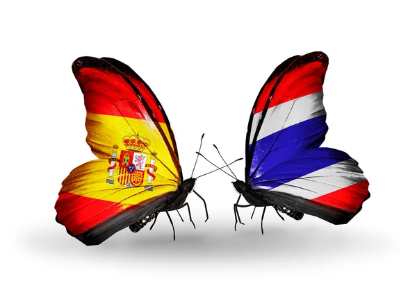 Butterflies with Spain and Thailand flags on wings — Stock Photo, Image