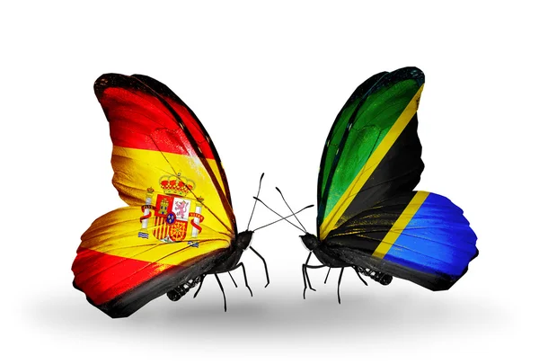 Mariposas con banderas de España y Tanzania en alas — Foto de Stock