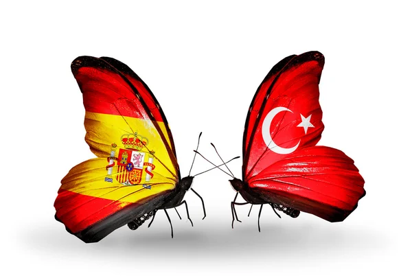 Farfalle con bandiere Spagna e Turchia sulle ali — Foto Stock