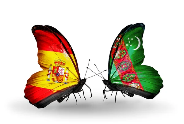 पंखों पर स्पेन और तुर्कमेनिस्तान ध्वज के साथ तितली — स्टॉक फ़ोटो, इमेज