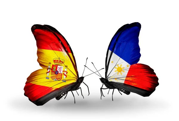 Butterflies with Spain and Philippines flags on wings — Stock Photo, Image