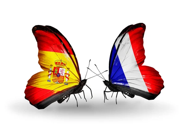 Mariposas con banderas de España y Francia en alas — Foto de Stock