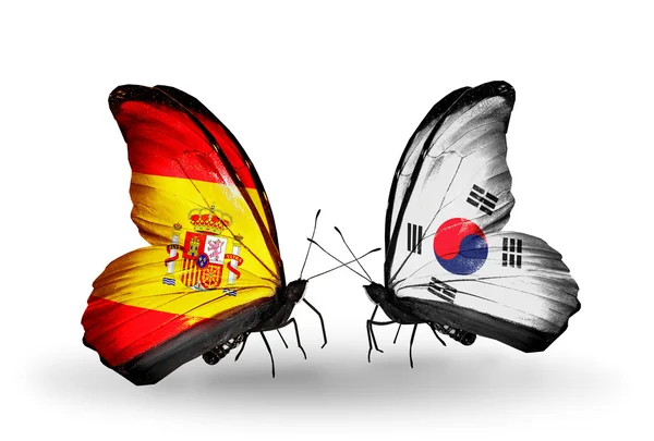 Borboletas com bandeiras da Espanha e da Coreia do Sul em asas — Fotografia de Stock