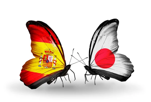 Farfalle con bandiere Spagna e Giappone sulle ali — Foto Stock