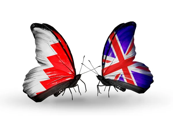 Butterflies with Bahrain and UK flags on wings — Stock Photo, Image