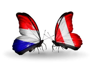 Kelebek kanatları üzerinde Hollanda ve peru bayraklı