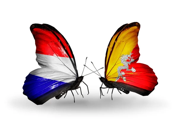 Butterflies with Holland and Bhutan flags on wings — Stock Photo, Image