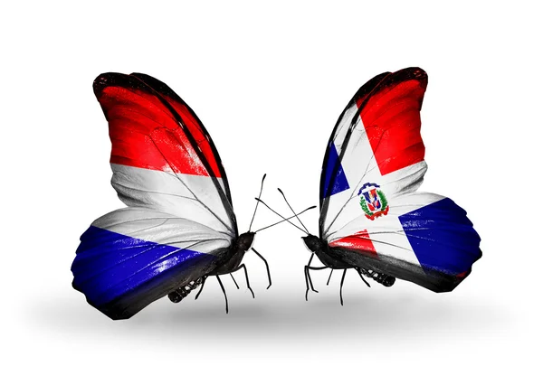Borboletas com bandeiras da Holanda e Dominicana em asas — Fotografia de Stock
