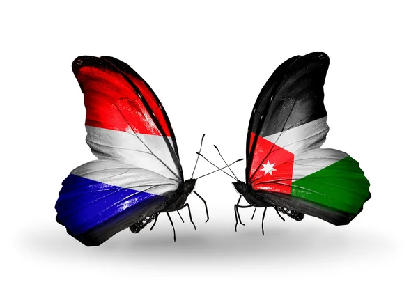 Butterflies with Holland and Jordan flags on wings — Stock fotografie