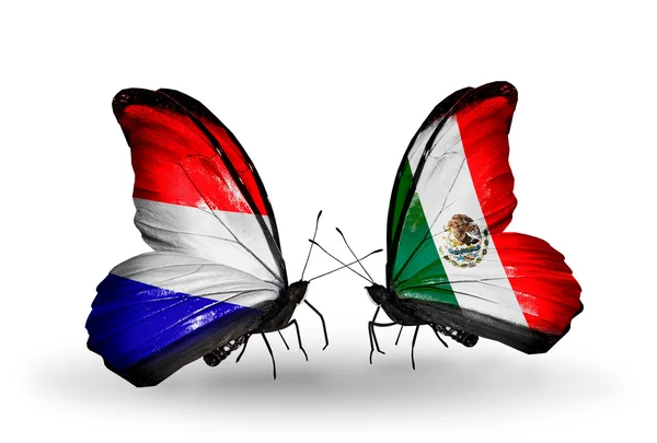 Butterflies with Holland and Mexico flags on wings — Stock Photo, Image