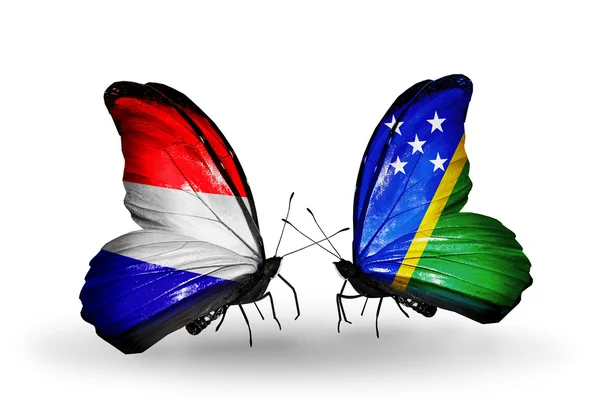 Farfalle con bandiere Olanda e Isole Salomone sulle ali — Foto Stock