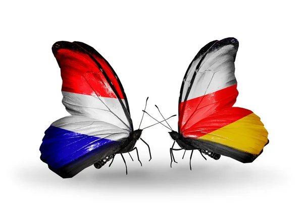 Butterflies with Holland and South Ossetia flags on wings — Stock Photo, Image