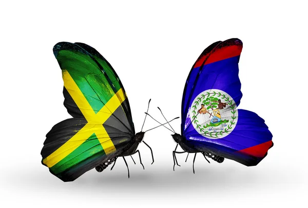 Papillons avec des drapeaux Jamaïque et Belize sur les ailes — Photo