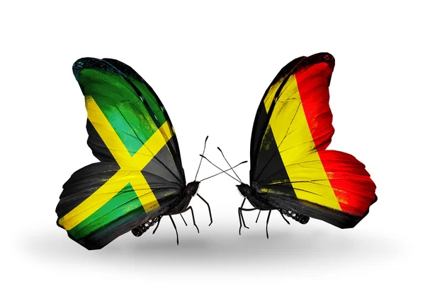 Schmetterlinge mit jamaika- und belgischen Flaggen auf Flügeln — Stockfoto