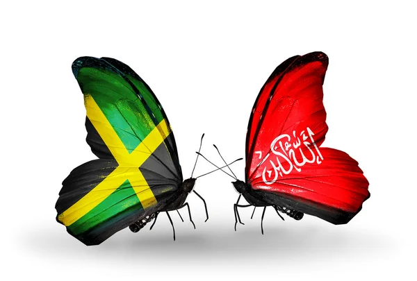 Schmetterlinge mit Jamaika- und Waziristan-Flaggen auf Flügeln — Stockfoto