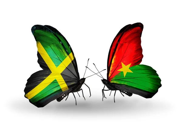 Mariposas con banderas de Jamaica y Burkina Faso en alas —  Fotos de Stock