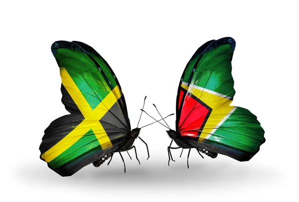 Mariposas con banderas de Jamaica y Guyana en alas —  Fotos de Stock