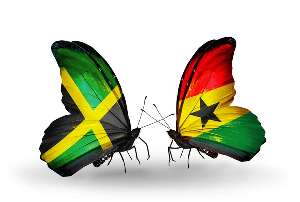 Motyle z Jamajki i ghana flagi na skrzydłach — Zdjęcie stockowe