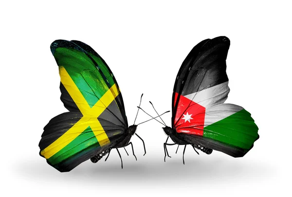 Mariposas con banderas de Jamaica y Jordania en alas — Foto de Stock