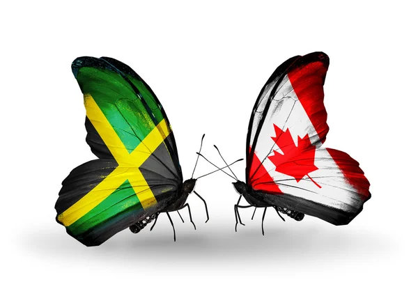 Motýli s příznaky Jamajky a Kanada na křídlech — Stock fotografie