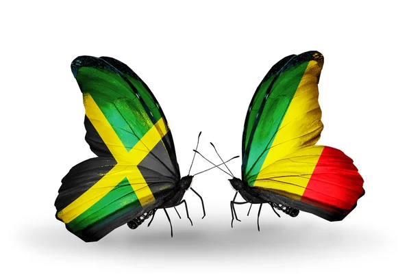 Vlinders met jamaica en kongo vlaggen op vleugels — Stockfoto