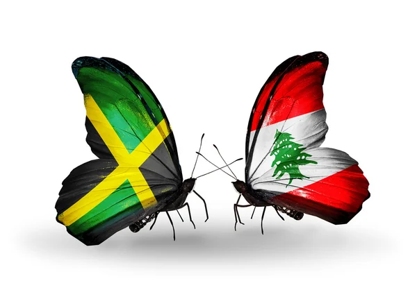 Papillons avec drapeaux Jamaïque et Liban sur les ailes — Photo