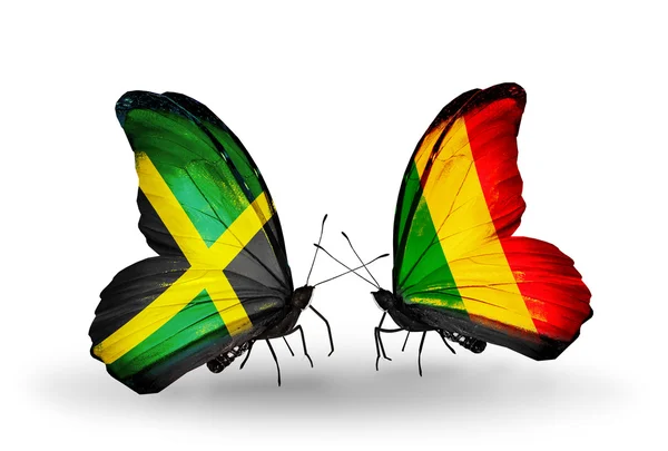 Schmetterlinge mit Jamaika- und Mali-Fahnen auf Flügeln — Stockfoto